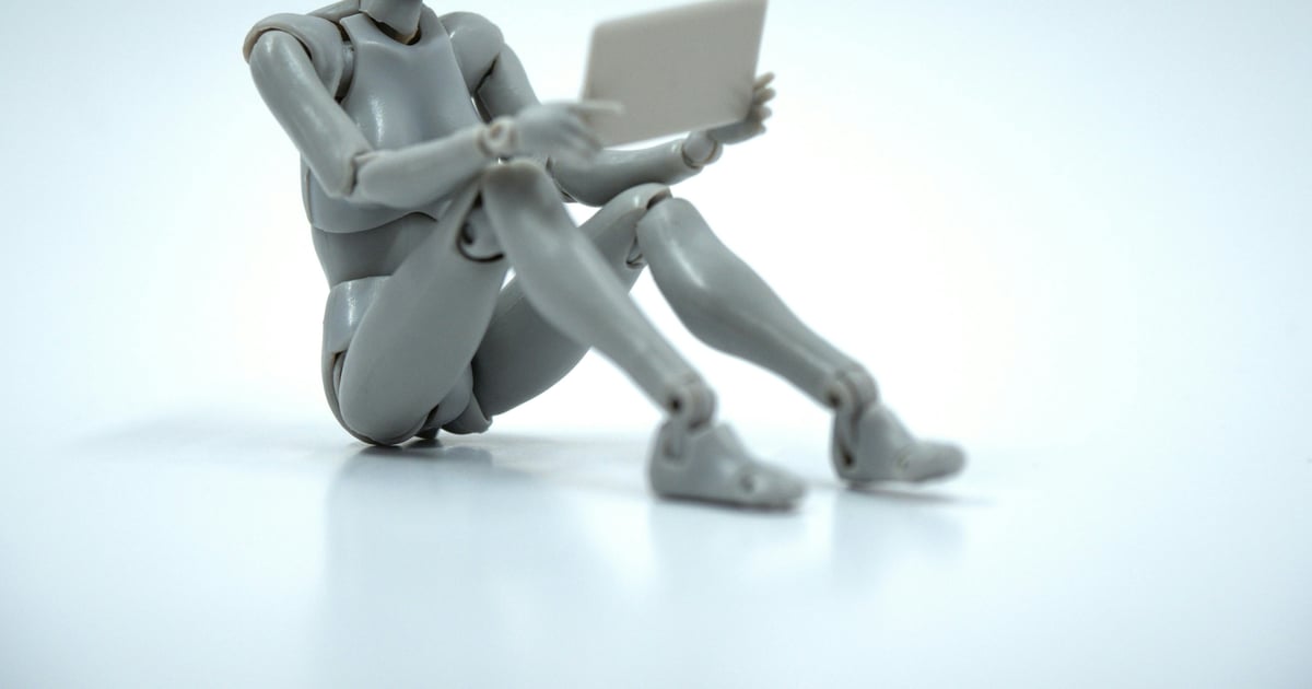 A puppet using a tablet, representing Google Ads AI automation